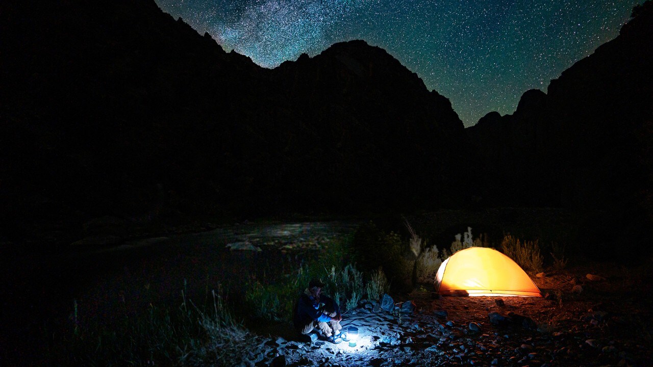 The author enjoys solitude and a fresh trout dinner while camping.