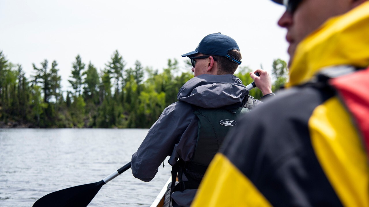 Jack and Peter navigate a lake on the way to the campsite.