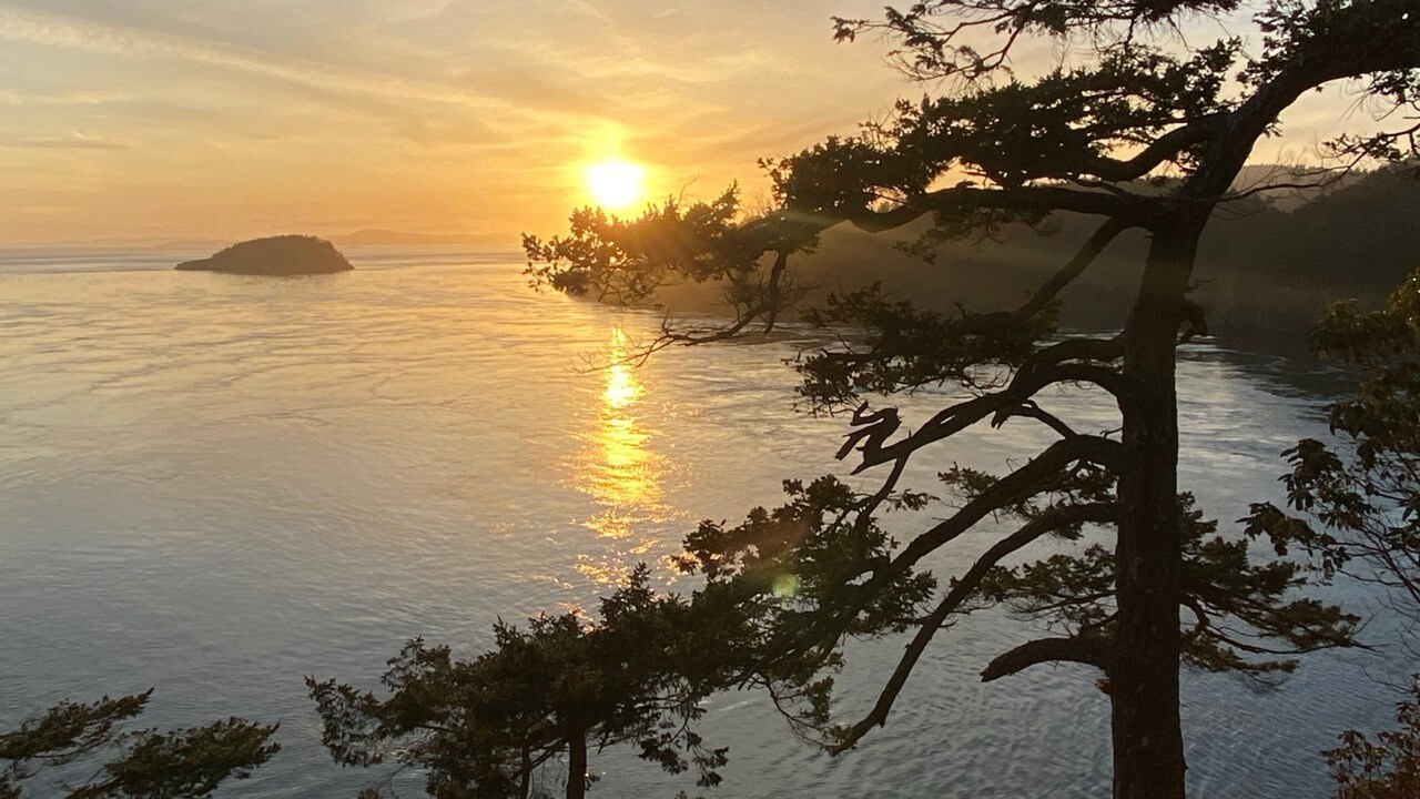 The sun sets on Whidbey Island in Puget Sound.