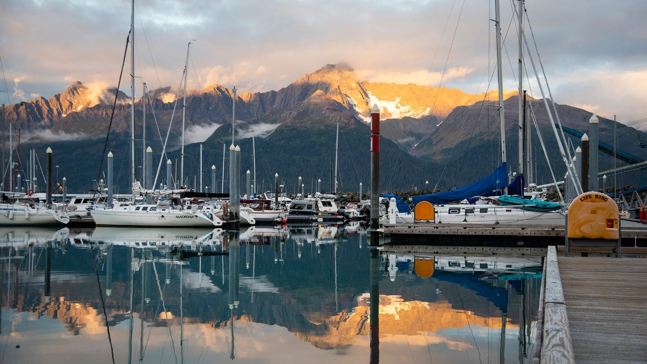 The sun sets on Seward Boat Harbor, bringing as sense of calm after a long day of sightseeing.