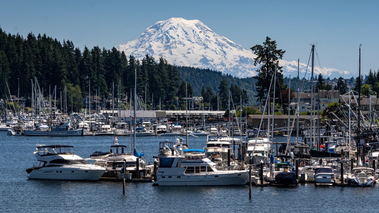 Mount Rainier rises behind Gig Harbor, Washington.