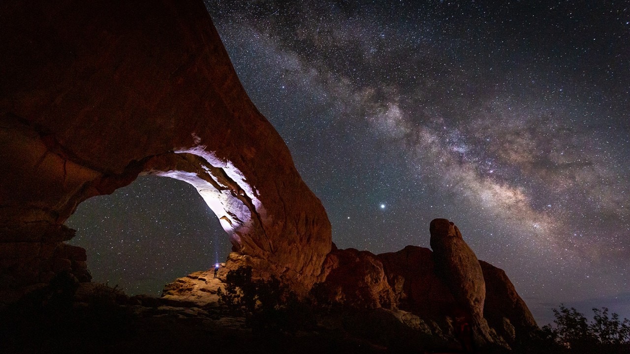 The Milky Way stretches across the night sky in Arches National Park. Photo by Derek Jerrell