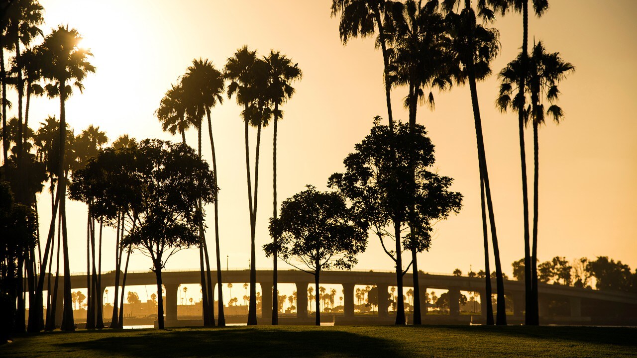 The sun sets at Mission Bay in San Diego.