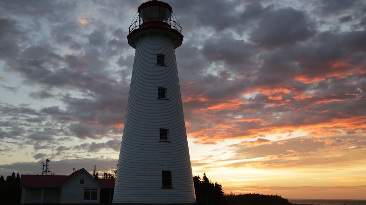 The sun rises on the Point Prim Lighthouse.