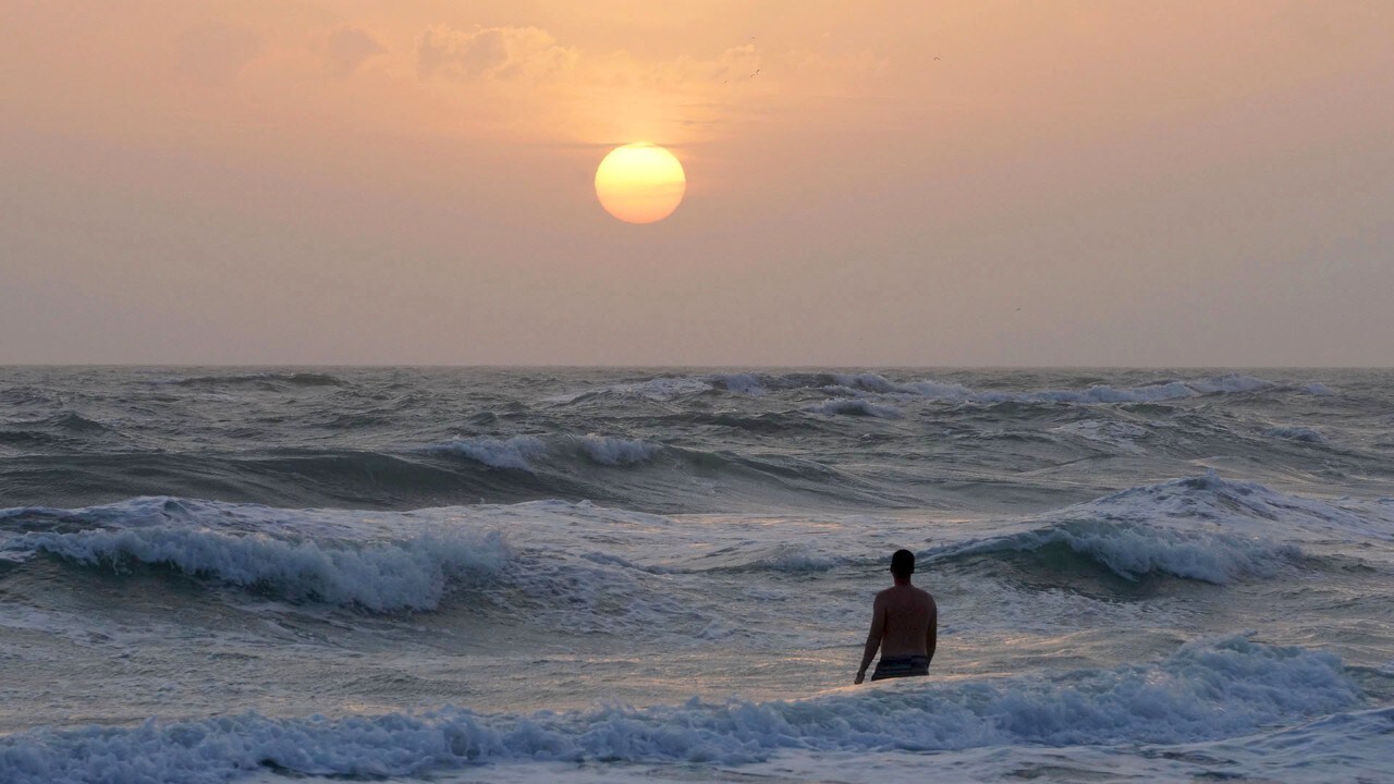 Choppy waves roll in after a storm in Siesta Key.