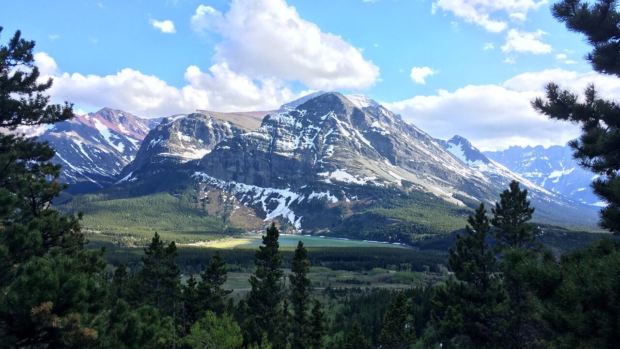 Glacier National Park is known for bright blue lakes, lush valleys and the imposing Rocky Mountains.