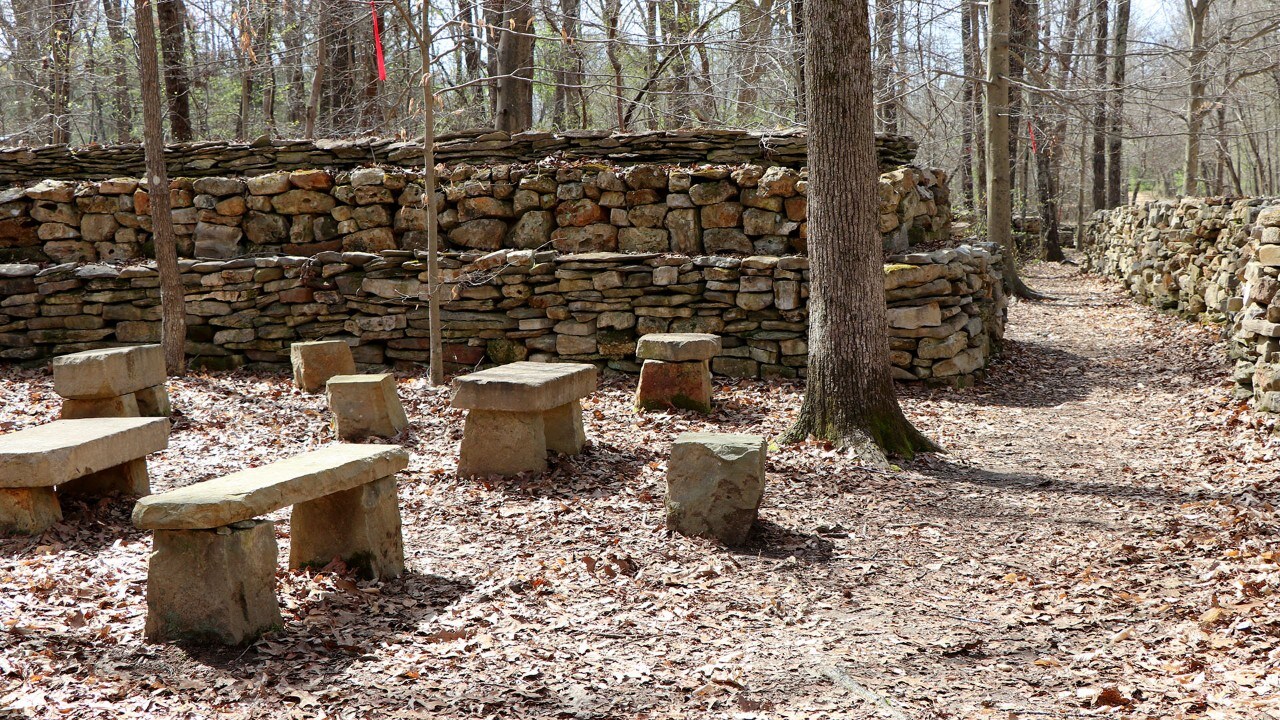 Rock slab benches offer resting spots.