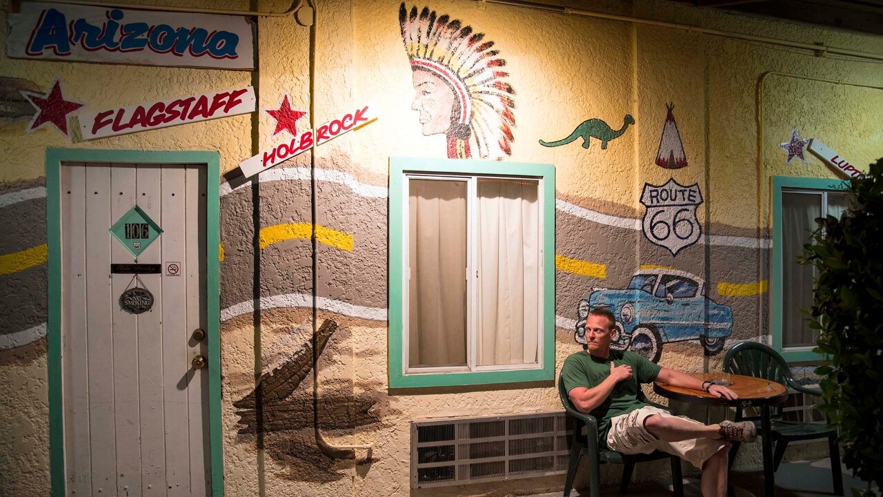 The author sits outside his room at the El Trovatore Motel on a quiet evening in Kingman, Arizona