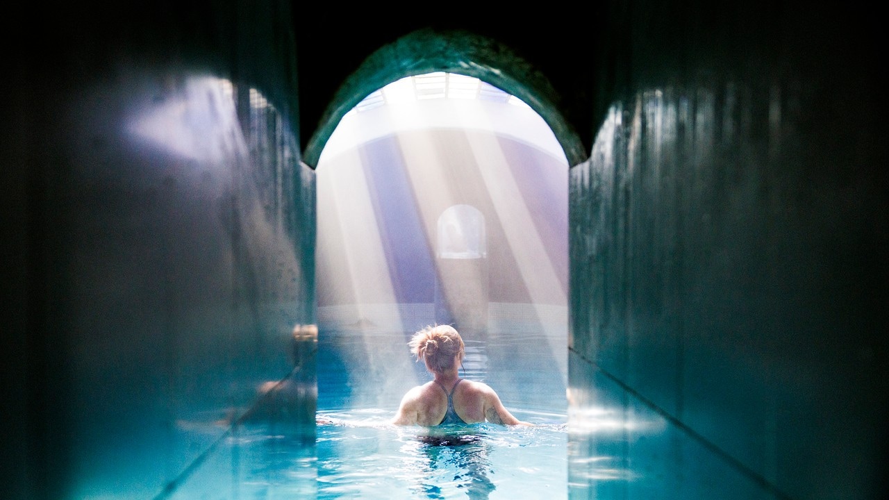 Light streams through the glass roof at Escondido Place hot springs.