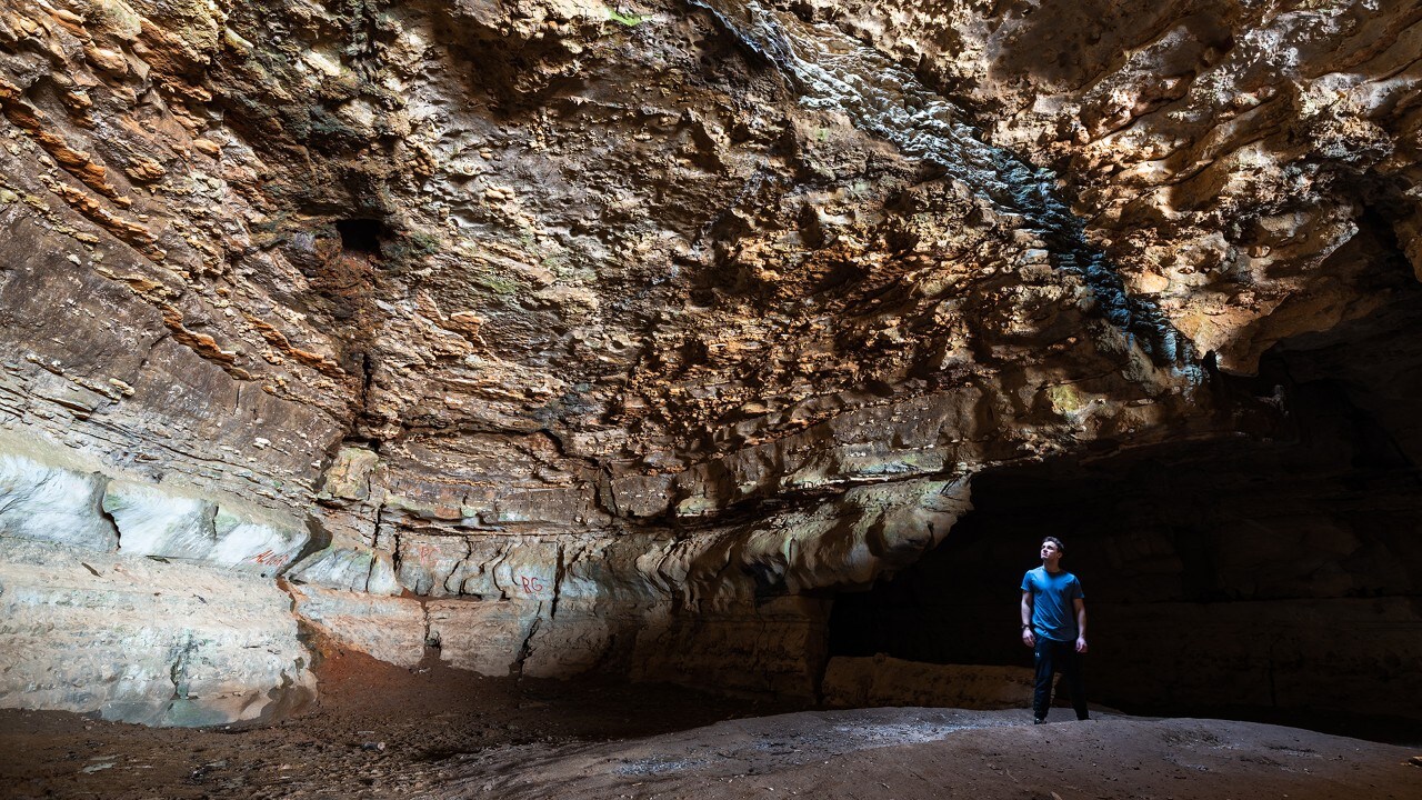 The author explores Cave-in-Rock, which was carved out of the limestone rock by water thousands of years ago.