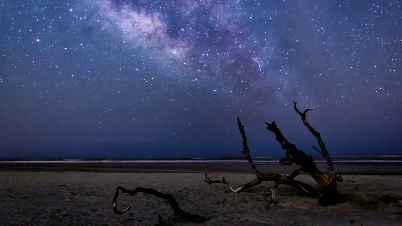 The Milky Way shines above the Atlantic Ocean.