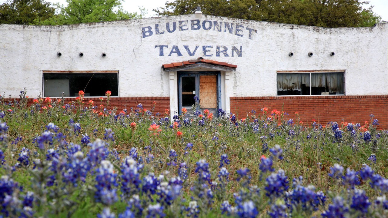 A boarded-up tavern