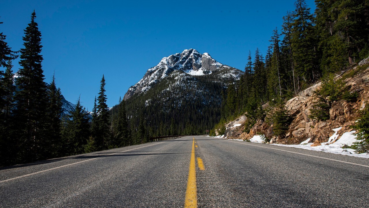 Snow-capped mountains highlight the drive through the national park.