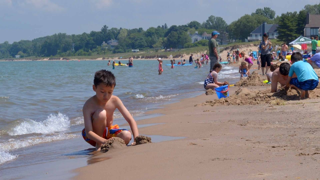 Kids play on a South Haven beach.