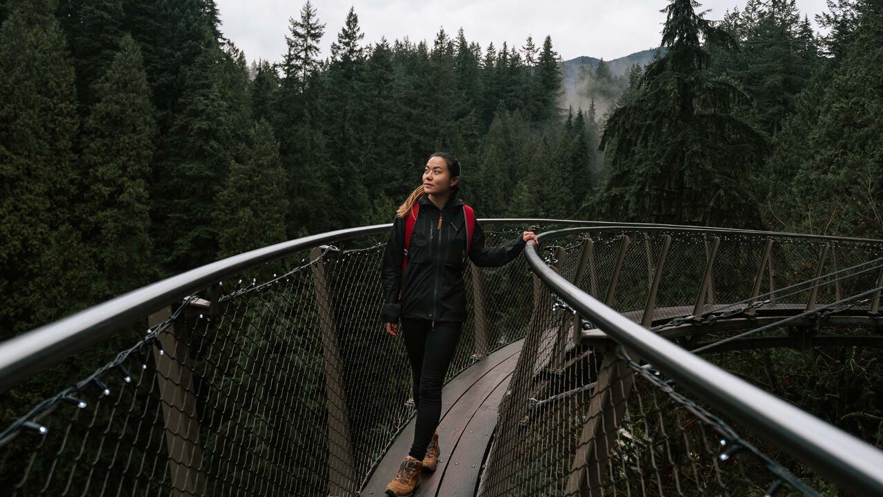 Emma walks on the Cliffwalk at Capilano Suspension Bridge Park.