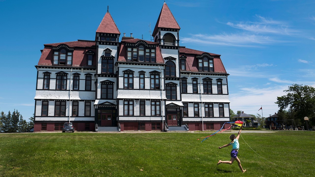 Abi Unglaub runs with a kite at Lunenburg Academy in Lunenburg, N.S. on Tuesday, June 27, 2017.