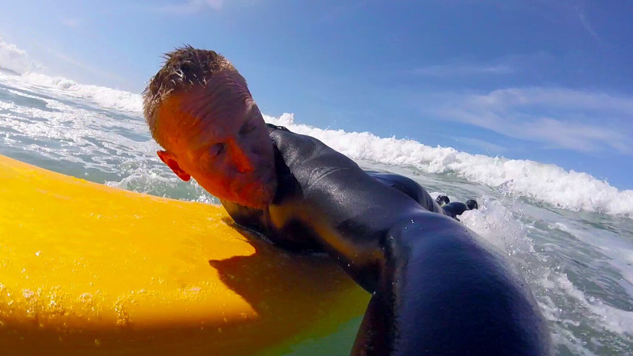 The author paddles into the surf along Agate Beach in Newport, Oregon.