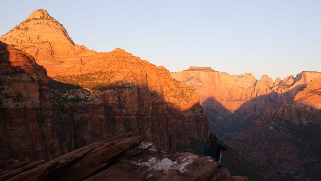 The sun rises on the Canyon Overlook Trail.