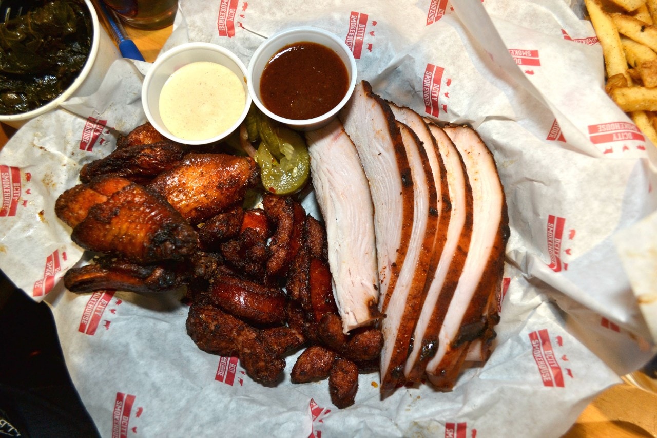 The smoked wings accompanied by cilantro ranch sauce are one of the menu highlights at DCity Smokehouse.