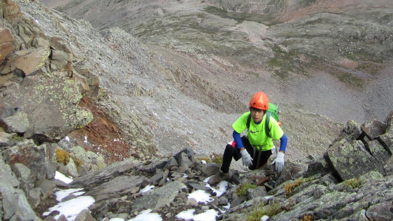 Daniel takes a breather before making the final push to summit 14,159-foot El Diente Peak, his 36th fourteener. Photo by Scott Otteman