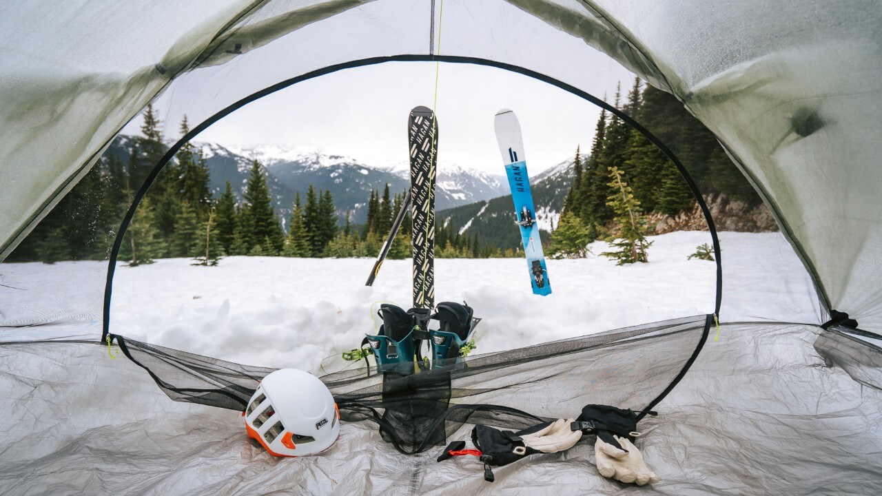 Skis anchor the tents, which keeps them from blowing away on the windy mountain.