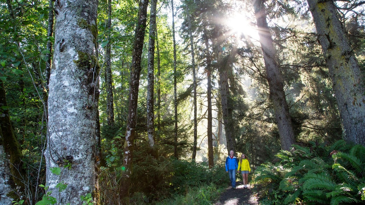 Brad and Tonya Clement hike through Hug Point State Park.