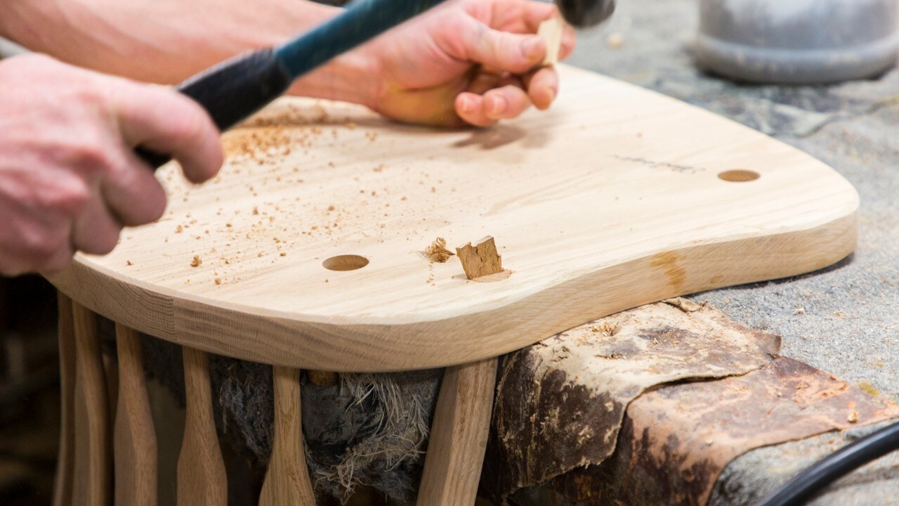 Connecting a chair seat to a back at F&N Woodworking.