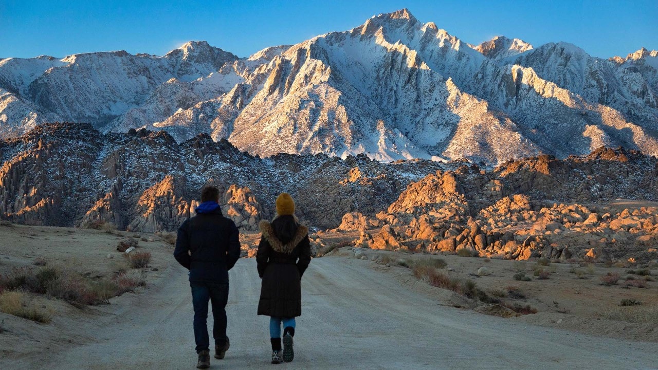 Megan and Jeff walk toward Alabama Hills National Scenic Area.