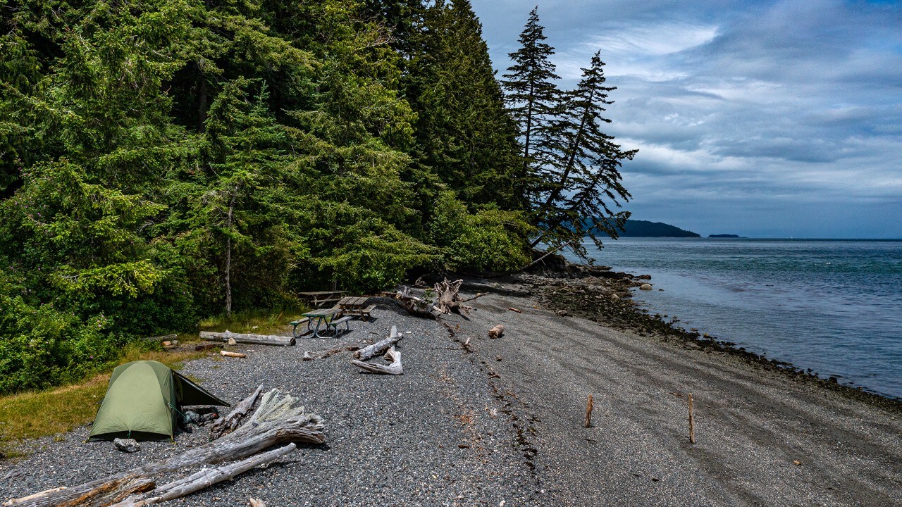 Pelican Beach campsites include fire pits and picnic tables.