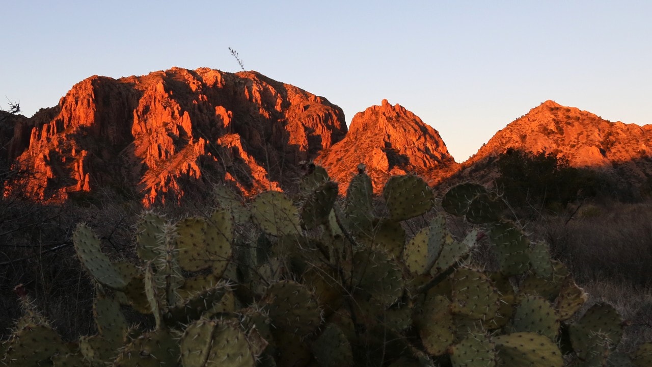 The Chisos Mountains turn bright orange at sunset