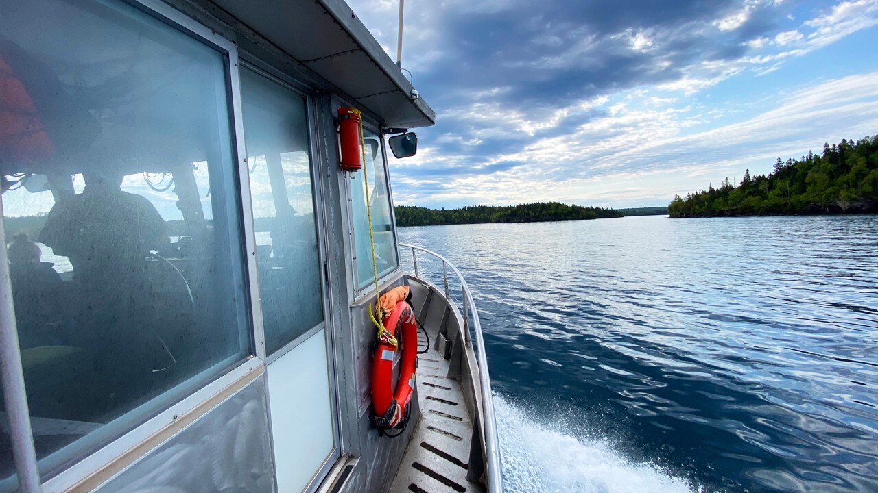 The Voyageur II ferry arrives in Isle Royale National Park. 