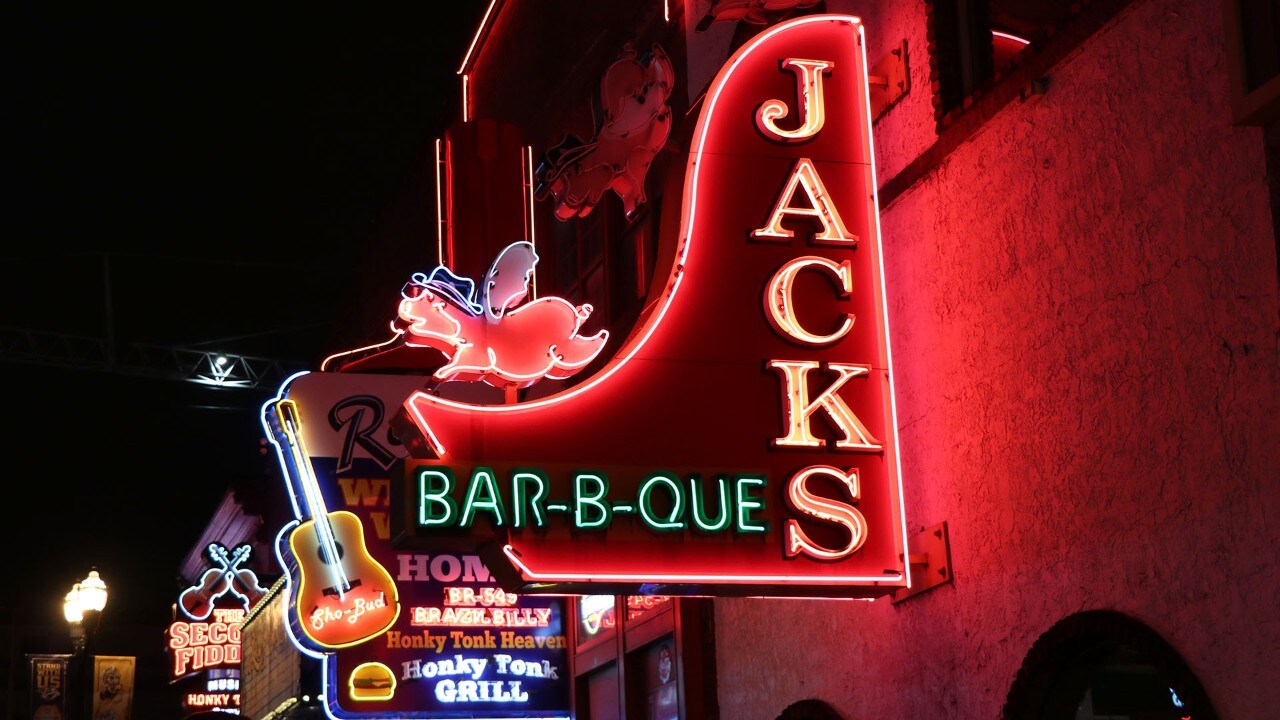 Neon signs light the way along Lower Broadway.