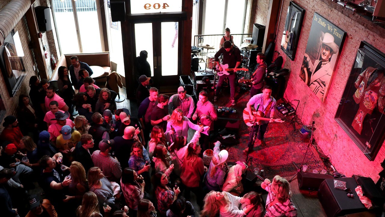 Partiers fill the floor at Nudie's nightclub in Nashville.