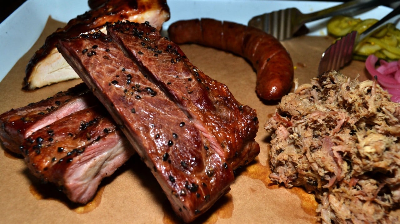 Texas Jack's Pitmaster Warren Zuniga seasons the meaty St. Louis-style ribs with salt and pepper, apple cider vinegar and chicken stock.