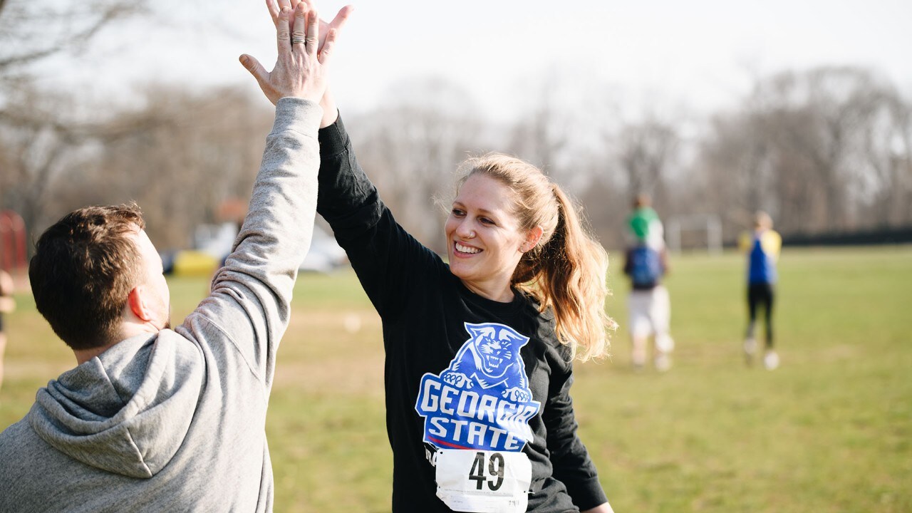 Abby and her boyfriend high five at the race.