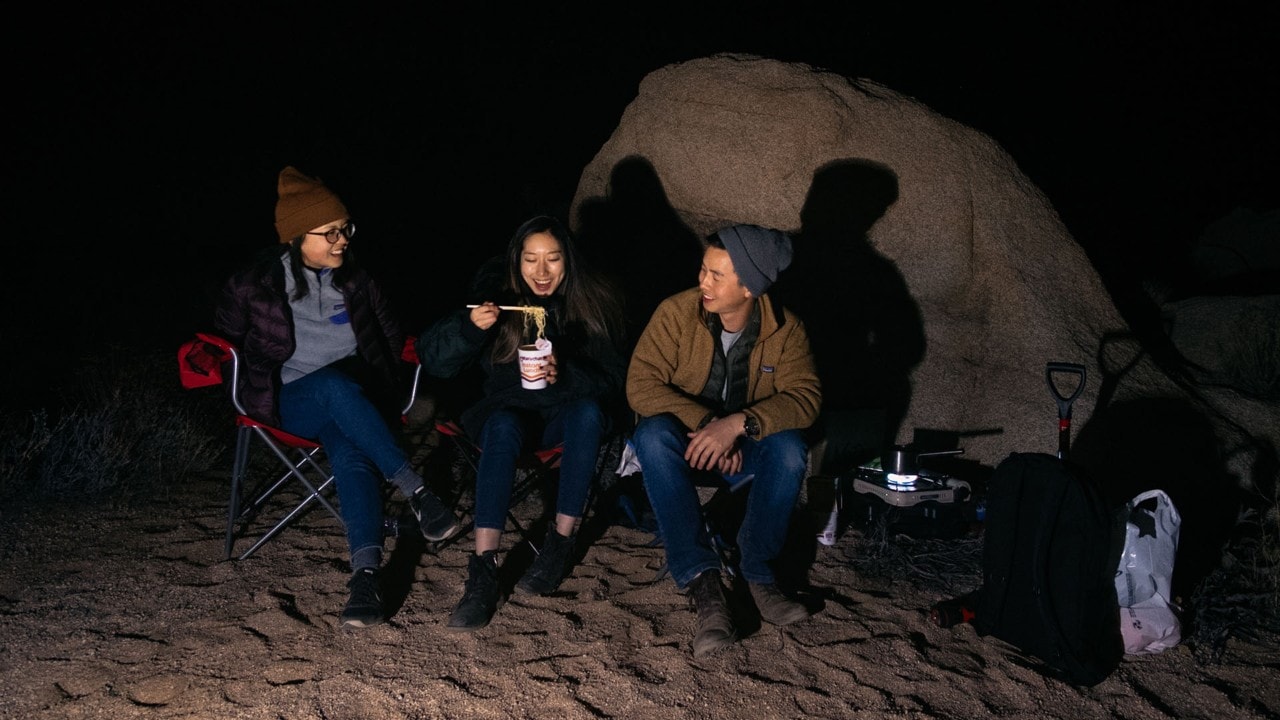 From left: Christine Yoo, Helen Baik and Trevor Wong eat dinner.