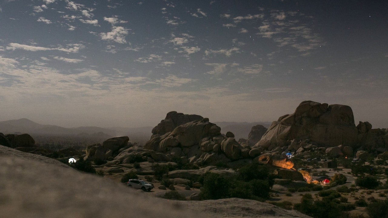 The full moon shines at night and creates a surreal landscape.