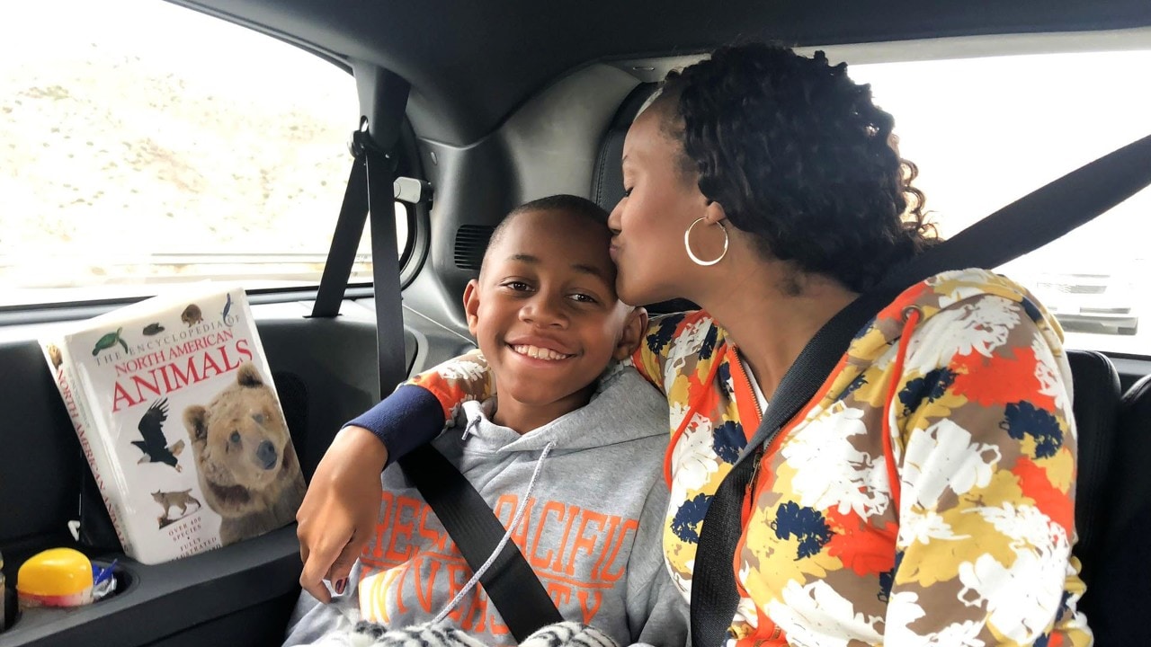 Sion (left) and Jehava Brown spend quality time together on the ride.